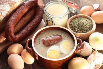 Sour rye soup with sausage and egg with the ingredients used in its preparation