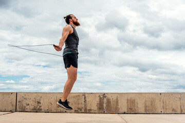 Young Man Exercising Near the Coast