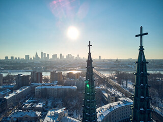 Beautiful panoramic aerial drone view of the Warsaw City Centre through two church towers with huge crosses - St. Florian Cathedral, Warsaw, Poland, EU - obrazy, fototapety, plakaty