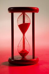 Hourglass on infinite colorful background, marking the time of the game. An old way of counting...