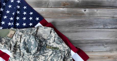 Flag of United States and military clothing on vintage wooden planks for the freedom holidays