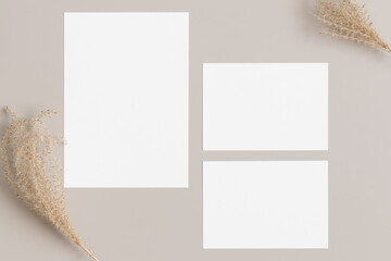 Wedding invitation stationery mockup with a dried grass decoration. Dimensions: 5x7
