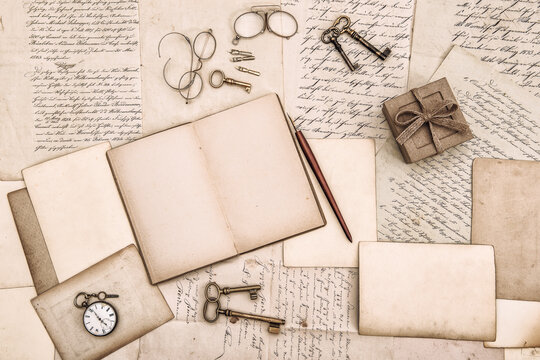 antique accessories, open book and old handwritten letters