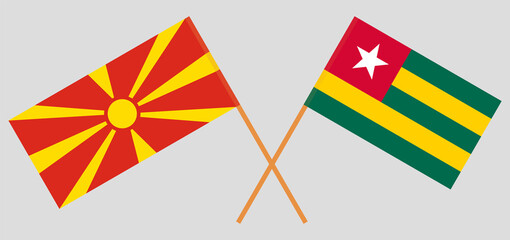 Crossed flags of North Macedonia and Togo. Official colors. Correct proportion