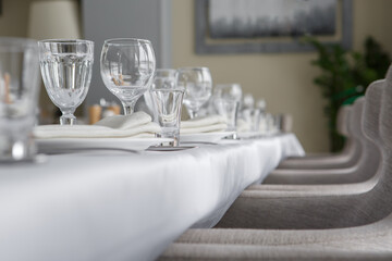 Empty wine glasses are on the table in the restaurant.