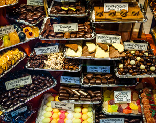 Delicious chocolates and other goodies in a shop window.