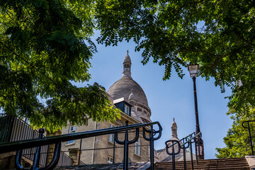 Sacre Coeur in Paris France as seen from the stairs behind the Basilica.