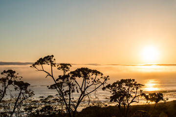 USA, California. Sunset over the Pacific Ocean, seen from Pacific Coast Highway on San Simeon North Shore.