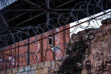 shoe in barbed wire of old abandoned building