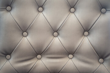 sofa buttoned of textured background