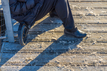 Close up view of female having rest on kick scooter. Sweden. 