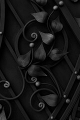 forged elements of a metal fence of gray tones