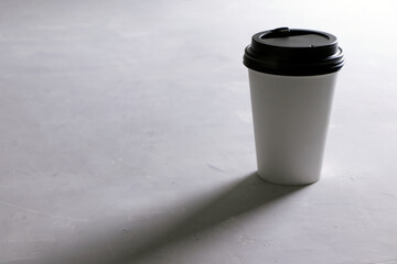 A white paper cup on a white background. A Coffee cup. A Tea cup