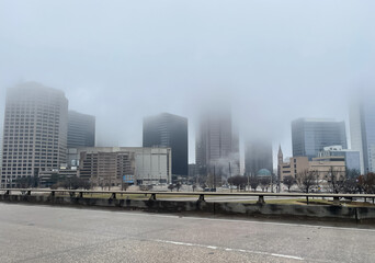 City buildings covered in heavy fog
