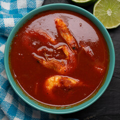 Shrimp soup on dark background. Mexican food