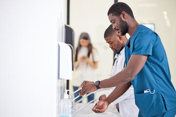 Black Doctor Man washing hands properly with soap to be protected for Coronavirus 2019-nCoV during...