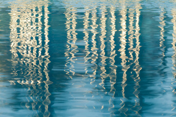 USA, California, San Diego. Reflections on Children's Park pool in Martin Luther King Jr. Promenade.