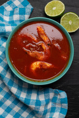 Shrimp soup on dark background. Mexican food