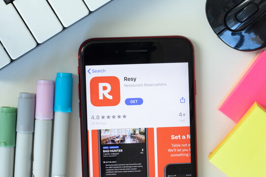 New York, USA - 2 March 2021: Resy mobile app icon on phone screen, Illustrative Editorial.