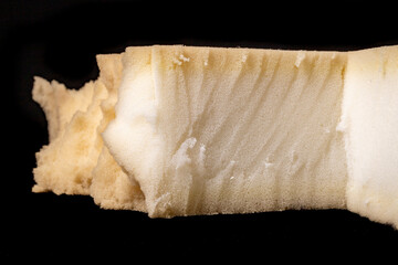 A cut sponge in an upholstery workshop. The material used to build soft sofas and armchairs.