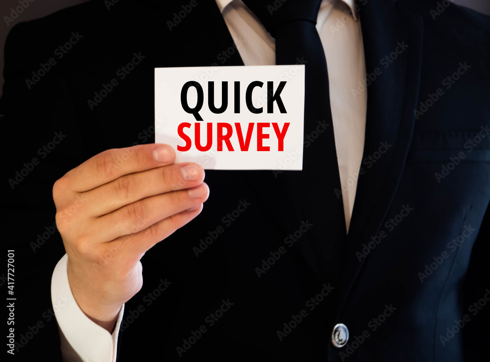 Poster quick survey text written on a notebook with pencils