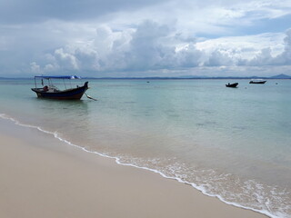 beautiful beach landscape with a southeast asia traditional boat