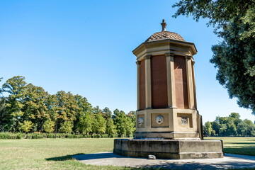 A temple-shaped fountain in the meadow called 