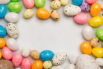 Fototapeta na wymiar Colorful easter eggs top view on white background