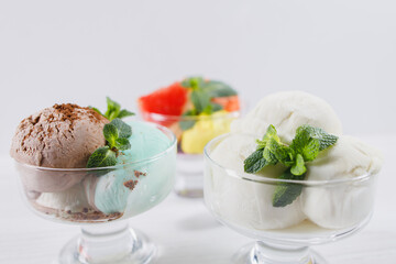 Summertime. Ice-cream scoops in glass sundae bowls. Holiday, vacation, summer delicious refreshing treats
