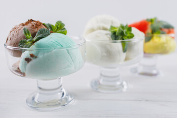 Summertime. Ice-cream scoops in glass sundae bowls. Holiday, vacation, summer delicious refreshing treats
