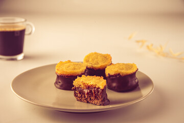alfajores de chocolate: a traditional dessert from Latin America, Argentina and Uruguay. Vanilla cookies with dulce de leche, chocolat and coconut