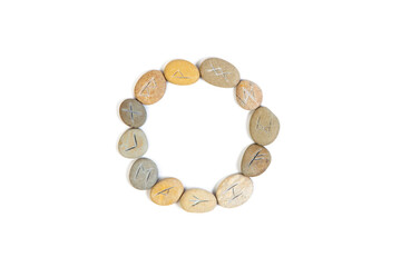 Rune Stones Arranged in Circle on White Background
