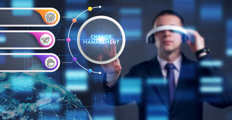 Business, Technology, Internet and network concept. Young businessman working on a virtual screen of the future and sees the inscription: Change management