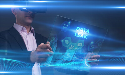 Business, Technology, Internet and network concept. Young businessman working on a virtual screen of the future and sees the inscription: Data leak