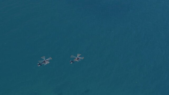 Aerial View of Helicopters Flying Over the Blue Ionian Sea in Greece