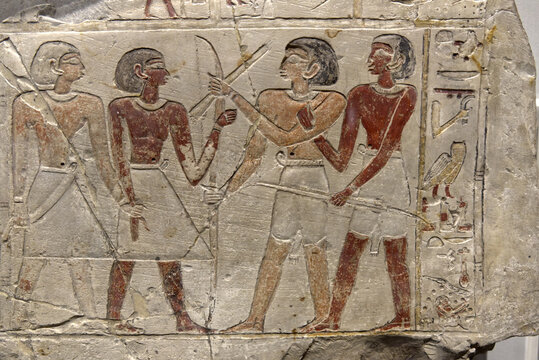 an Egyptian stele depicting hunters with bows