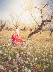 Woman with pink headscarf, enjoying and fighting cancer.