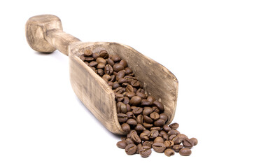 Coffee beans in a wooden scoop isolated on a white background. Roasted coffee beans isolated. A wooden scoop with coffee