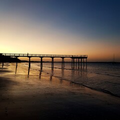 Fototapeta na wymiar beautiful sunset with a jetty at Hervey Bay, Queensland, Australia