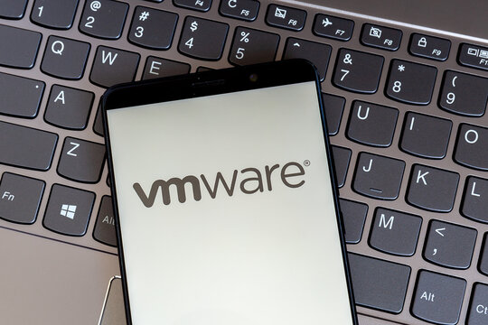 Toronto, On, Canada - February 27, 2021: VMware logo on smartphone screen on keyboard. VMware, Inc. is an American publicly traded software company