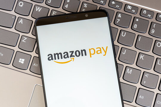 Toronto, Ontario, Canada - February 27, 2021: Amoazon pay logo on smartphone screen on keyboard. Amazon Pay is an online payments processing service owned by Amazon. 