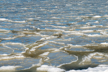 Frozen crystallized water and ice, on the surface of the ocean, with a slight skim of frozen water....