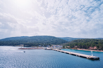 Fototapeta na wymiar Concrete sea pier on the mediterranean island.