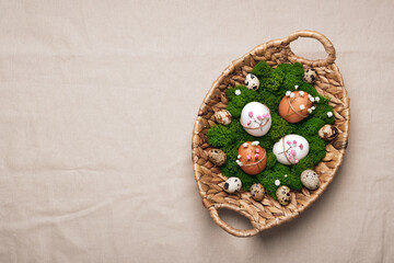 Easter eggs with natural flowers decor on linen tablecloth. Zero Waste Easter, copy space