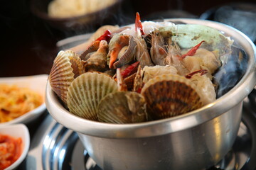 Steamed seafood dish with steaming and fresh seafood 김이 모락모락 나고신선한 해산물이 들어가 있는 해산물찜 요리