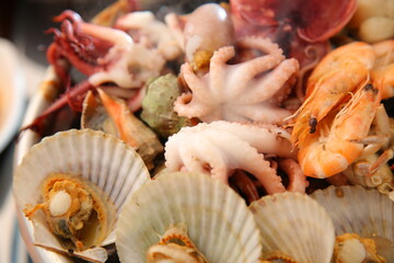 Steamed seafood dish with steaming and fresh seafood 김이 모락모락 나고신선한 해산물이 들어가 있는 해산물찜 요리