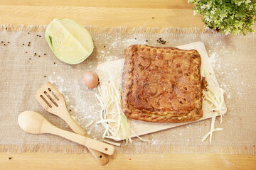Pie on a chopping board. The food is ready to eat. Puff Pastry pastry
