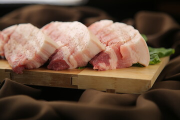 Grilled thick raw pork belly, a Korean barbecue dish 한국 바베큐 요리인 두툼한 생 삼겹살 구이