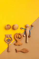 Children's wooden toys, rattles and teethers. Copy space.