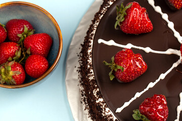 Chocolate cake with strawberries on top